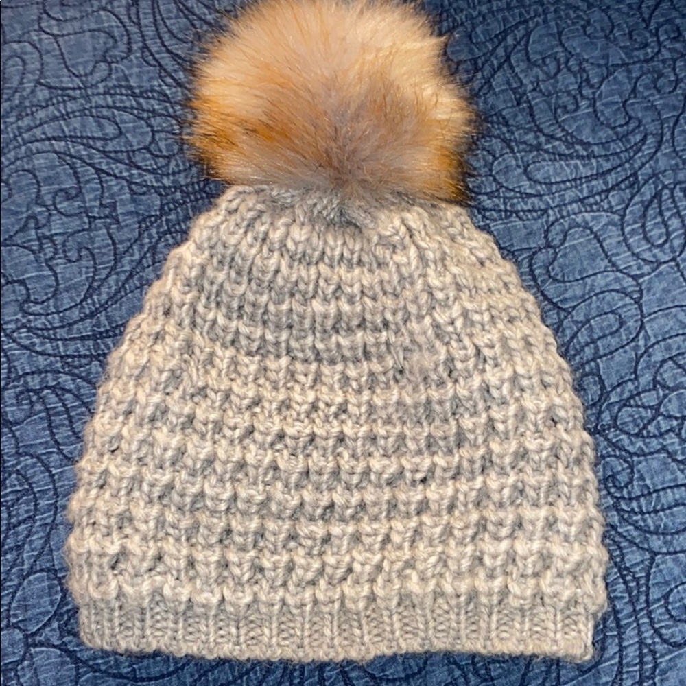 Winter hat with fur puff ball